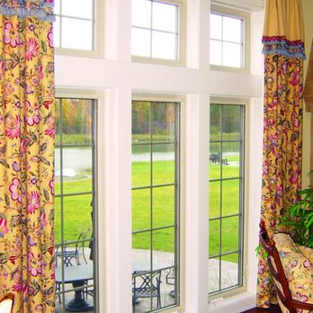 Volunteer Exteriors - a living room with large windows - General Contractors Near Me - Knoxville, Tennessee Volunteer Exteriors - a living room with large windows - General Contractors Near Me - Knoxville, Tennessee
