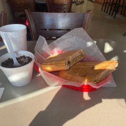 World Famous Cuban Sandwich (FULL) with a side of black beans and rice.