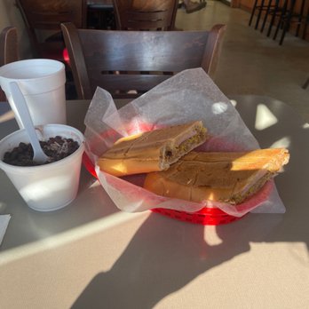 La cubanita sandwich - World Famous Cuban Sandwich (FULL) with a side of black beans and rice. - Sandwiches Near Me - Melbourne, Florida
