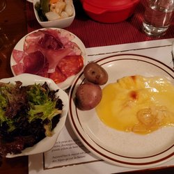 Restaurant Au Mazot Suisse - Raclette with potatoes, charcuterie and salad.