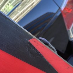 Pedigree Ski Shop - After repair, black plastic is still alright raised, fully separated from red plastic.. blade marks and new holes