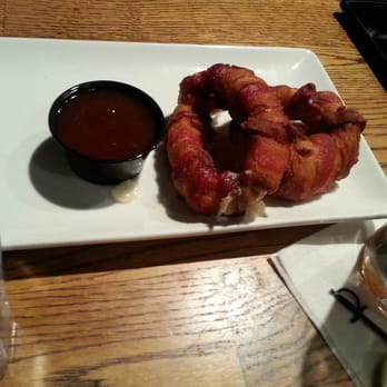 The Onion - Bacon wrapped onion rings filled with mozzarella cheese and deep fried - New American Near Me - Spokane, Washington The Onion - Bacon wrapped onion rings filled with mozzarella cheese and deep fried - New American Near Me - Spokane, Washington