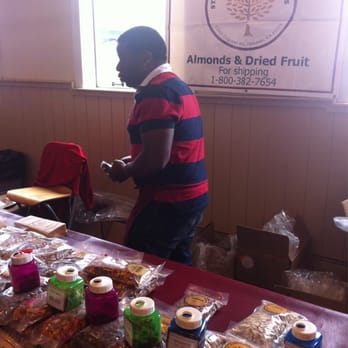 Stackhouse Brothers Orchards - a man standing in front of a table of food - Fruits & Veggies Near Me - Seattle, Washington Stackhouse Brothers Orchards - a man standing in front of a table of food - Fruits & Veggies Near Me - Seattle, Washington
