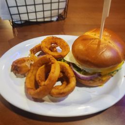 Bacon cheeseburger with fried egg and onion rings. Bacon cheeseburger with fried egg and onion rings.