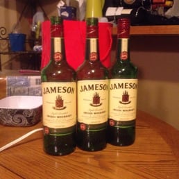 three bottles of jameson whiskey on a table three bottles of jameson whiskey on a table