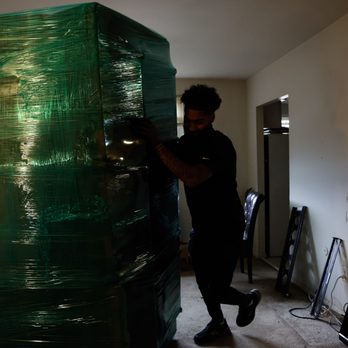 The Movers Moving - Fully wrapped sofa. - Movers Near Me