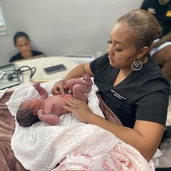Julia Underwood Midwifery - It's so special to have the whole family present while you get to weigh and measure the baby for the first time.