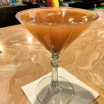 Peter's Pour House - Off The Stick Crown Royal Regal Apple cranberry juice, and ginger beer,  in a caramel drizzle glass all at the bottom of the glass. - American Near Me - Baltimore, Maryland