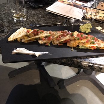 Topgolf - The quesadilla, with a small portion of sour cream and guacamole - New American Near Me - Edison, New Jersey Topgolf - The quesadilla, with a small portion of sour cream and guacamole - New American Near Me - Edison, New Jersey