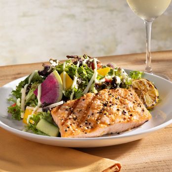 Seasons 52 - Sesame Grilled Salmon Salad features organic greens, mango, jicama, lemongrass sauce and toasted sesame dressing. - New American Near Me - Mclean, Virginia Seasons 52 - Sesame Grilled Salmon Salad features organic greens, mango, jicama, lemongrass sauce and toasted sesame dressing. - New American Near Me - Mclean, Virginia