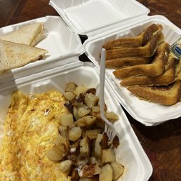 Seafood omelette, home fries, and French toast. Seafood omelette, home fries, and French toast.