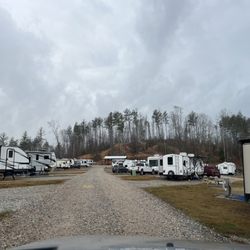 River Pointe RV Park & Campground - Long range view as you enter park. 5mph in park.  Plenty of dog waste stations for campers convenience.