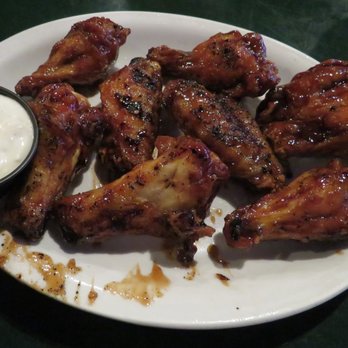 Gator's Dockside Ocala - So good...bone-in wings smothered in teriyaki sauce...dipped in blue cheese. Oh my. - American Near Me - Ocala, Florida