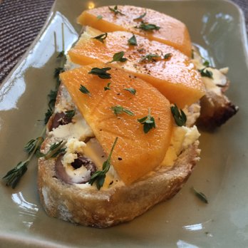 Morical House Garden Inn - First Course: olive bread with honeyed farm cheese and persimmon - Bed & Breakfast Near Me - Ashland, Oregon Morical House Garden Inn - First Course: olive bread with honeyed farm cheese and persimmon - Bed & Breakfast Near Me - Ashland, Oregon
