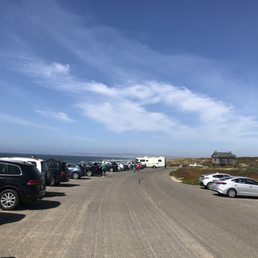Parking Lot from the South. Restroom pictured in back right. Parking Lot from the South. Restroom pictured in back right.