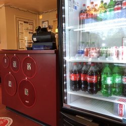 Pizza King - Customer counter and beverage service. There is no fountain service for drinks. Just 20 oz and 2 liter bottles.