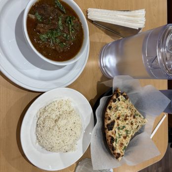Jugni Indian Kitchen - Goat curry with garlic naan. - Indian Near Me - Fort Worth, Texas Jugni Indian Kitchen - Goat curry with garlic naan. - Indian Near Me - Fort Worth, Texas