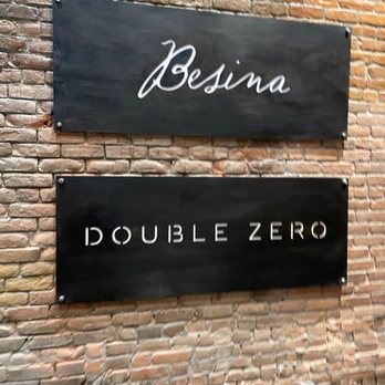 Double Zero - two signs on a brick wall - Pizza Near Me - Providence, Rhode Island