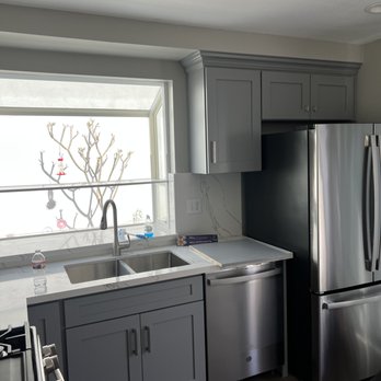Pech Services - a kitchen with stainless steel appliances - Carpenters Near Me Pech Services - a kitchen with stainless steel appliances - Carpenters Near Me