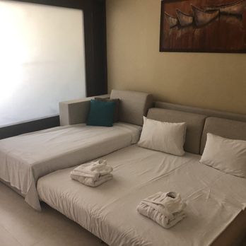 Azul Sensatori - Kids bed made up from couch with little robes - Hotels Near Me - Puerto Morelos, ROO