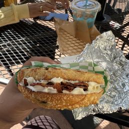 Jalapeno bagel with cream cheese and 4 slices of bacon.