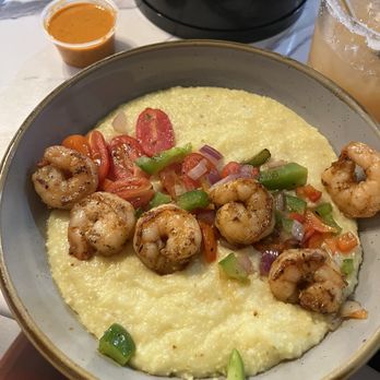 Table 22 - Shrimp and grits, creole sauce on the side - Soul Food Near Me - Tampa, Florida Table 22 - Shrimp and grits, creole sauce on the side - Soul Food Near Me - Tampa, Florida