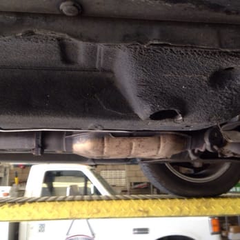 Gary's Muffler Shop - Car on lift, ready to test functionality of Cat - Auto Repair Near Me - Fresno, California