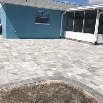 Brickyard - a blue house with a patio - Masonry/Concrete Near Me - Lakeland, Florida Brickyard - a blue house with a patio - Masonry/Concrete Near Me - Lakeland, Florida