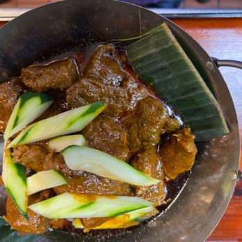 Banana Leaf - love the new way they serve Beef rendang right now. the fire on the bottom keep the heat and add more aroma into it,  highly recommend! - Malaysian Near Me - Houston, Texas