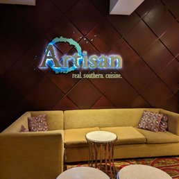 a couch and two tables in a lobby