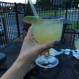 a person holding a drink a person holding a drink