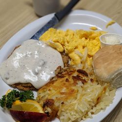 The Belgian Cafe - Country fried steak w/ scrambled eggs, hash browns and biscuit