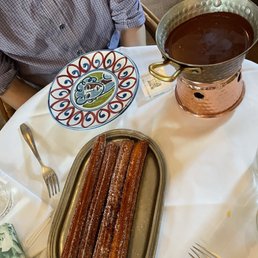 Our churros with chocolate! I wish the churros came without the sugar coating, otherwise it was a tasty dessert.