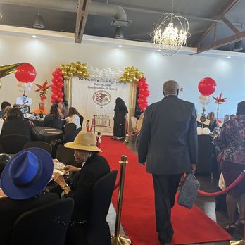 The Red Door Meeting Place - Red carpeting and backdrop for Senator Kimberly Lightford's Grandparents event. - Venues & Event Spaces Near Me - Broadview, Illinois