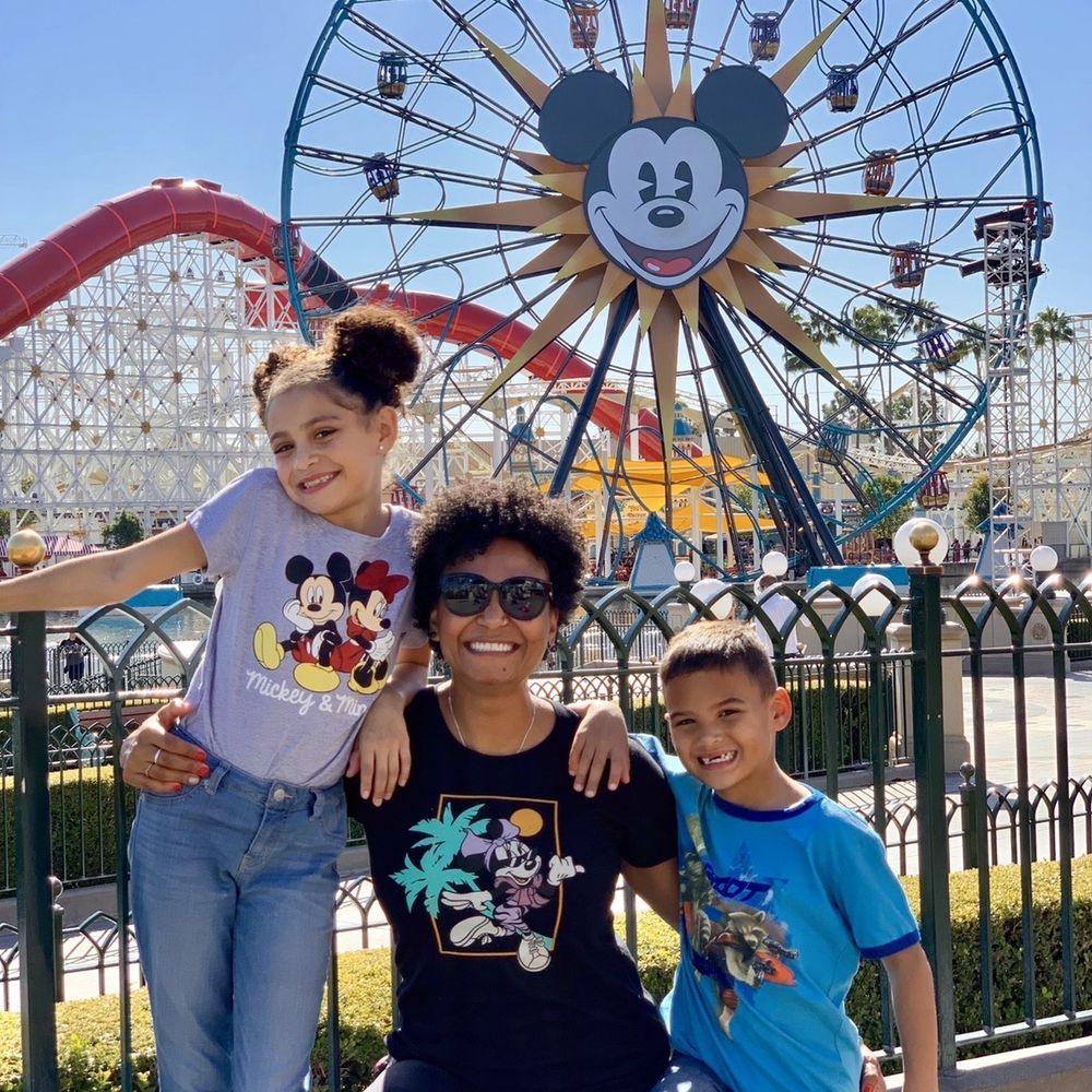 The Pixie Planner - My kids and I in front of the Mickey Ferris Wheel - Travel Services Near Me The Pixie Planner - My kids and I in front of the Mickey Ferris Wheel - Travel Services Near Me
