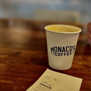 Monaco's Coffee - a cup of coffee on a table - Coffee & Tea Near Me - Geneva, New York