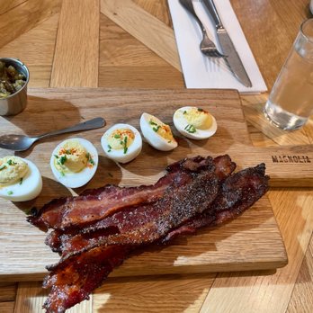 Magnolia Table - Deviled eggs with jalapeño jam and brown sugar bacon - Breakfast & Brunch Near Me - Waco, Texas Magnolia Table - Deviled eggs with jalapeño jam and brown sugar bacon - Breakfast & Brunch Near Me - Waco, Texas