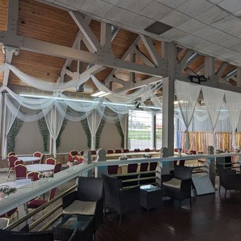Sister's Grill - a dining room with tables and chairs - Somali Near Me - Columbus, Ohio