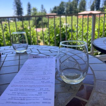 Montoliva Vineyard & Winery - a glass of wine on a table - Wineries Near Me - Grass Valley, California Montoliva Vineyard & Winery - a glass of wine on a table - Wineries Near Me - Grass Valley, California
