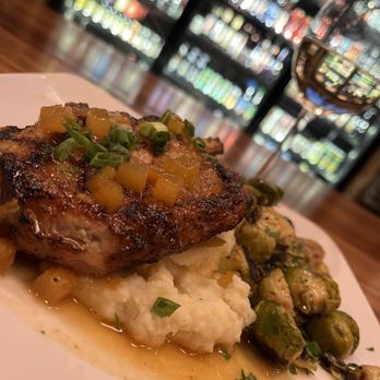 Sedona Taphouse - Pork chop seasonal bourbon mashed potatoes & Roasted Brussels Sprouts - New American Near Me - Midlothian, Virginia Sedona Taphouse - Pork chop seasonal bourbon mashed potatoes & Roasted Brussels Sprouts - New American Near Me - Midlothian, Virginia