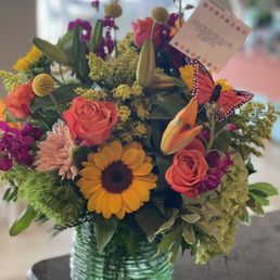 Fresh cut flower arrangement is a gorgeous selection of bright cheery flowers. Fresh cut flower arrangement is a gorgeous selection of bright cheery flowers.