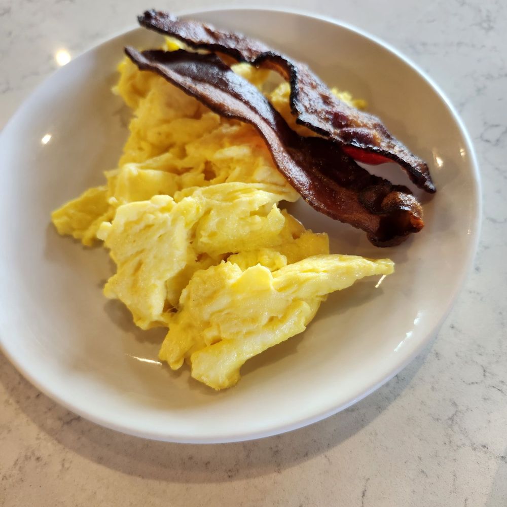 Another Broken Egg Cafe - Side of scrambled eggs and bacon - Breakfast & Brunch Near Me - West Melbourne, Florida Another Broken Egg Cafe - Side of scrambled eggs and bacon - Breakfast & Brunch Near Me - West Melbourne, Florida