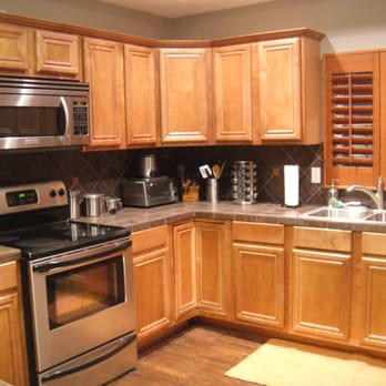 911 Handyman - a kitchen with stainless steel appliances - General Contractors Near Me