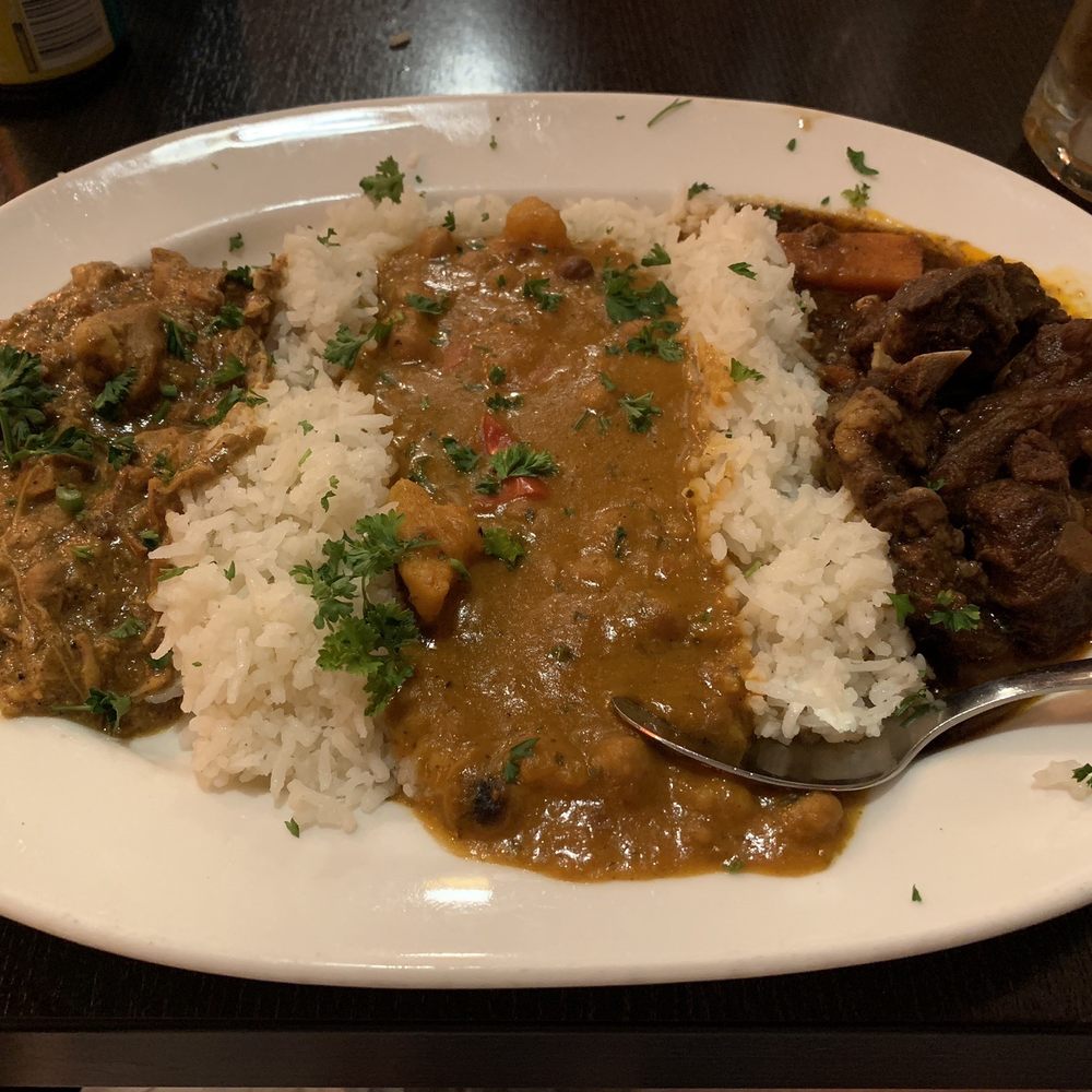 Jambo Cafe - Combination Plate--(l-r) Island Spice Chicken Coconut Stew, Ethiopian Chickpea Berbere Stew, Caribbean Goat Stew - Caribbean Near Me - Santa Fe, New Mexico Jambo Cafe - Combination Plate--(l-r) Island Spice Chicken Coconut Stew, Ethiopian Chickpea Berbere Stew, Caribbean Goat Stew - Caribbean Near Me - Santa Fe, New Mexico