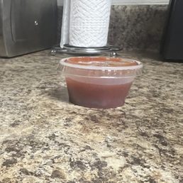 This is the to-go Salsa they gave me in an extra small condiment cup made for Ketchup/Mustard. This is the to-go Salsa they gave me in an extra small condiment cup made for Ketchup/Mustard.