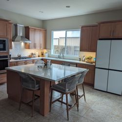 Full view of our kitchen. We've had many friends gather since the remodel and I love that our family dinners are at the island.