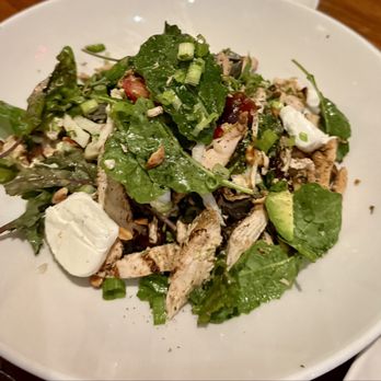Nick's Manhattan Beach - CALIFORNIA SALAD kale, cabbage, dates, goat cheese, strawberries, green onions, avocado, macadamia nuts, almonds, champagne vinaigrette. - American Near Me - Manhattan Beach, California