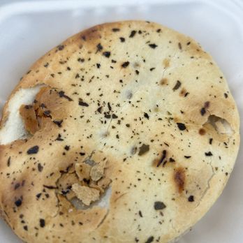 Kiwi Kuisine - a flat bread in a styrofoam container - Imported Food Near Me - Alexandria, Virginia