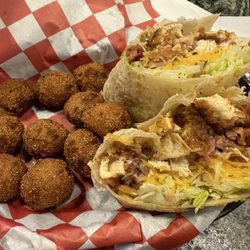 Rooster’s Sports Bar & Grill - Owasso - Chicken bacon and ranch wrap with hush puppies. Not a fan of the hush puppies but the wrap was amazing.
