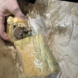 Pop's Italian Beef - Unwrapping a Polish sausage and Italian beef sandwich